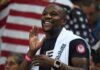 Showtime Money Missing – Boxing Legend Cries Foul Floyd Mayweather Jr. smiling and cheering with a towel over his shoulders