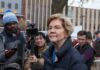 Elizabeth Warren speaking to reporters outdoors