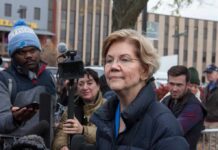Elizabeth Warren speaking to reporters outdoors
