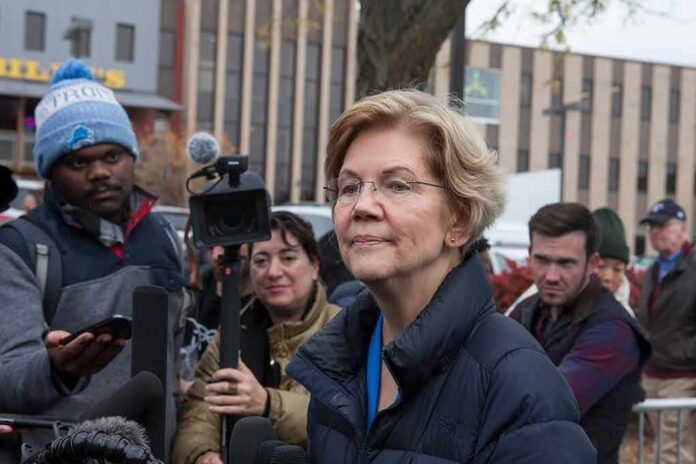 Elizabeth Warren speaking to reporters outdoors