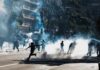 Protesters running through tear gas on a city street