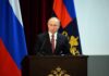 One Diplomatic Remark Draws Fire From Both Parties speaker at podium with flags in background