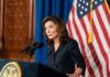 Sky-High Antisemitism, Explosive Hochul Quote Kathy Hochul speaking at a podium with microphones and a U.S. flag behind her