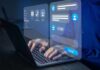 Hands typing on laptop with chatbot interface overlay