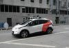 Autonomous test car with roof sensors on a city street