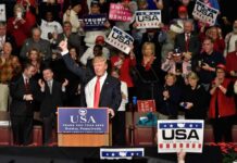 A Familiar Dance Returns To The Political Stage Donald Trump addresses a rally crowd at a podium, raising his fist
