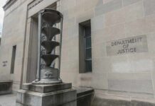 Department of Justice building exterior with sculptural fountain